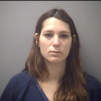 Suspect in love triangle assault arraigned