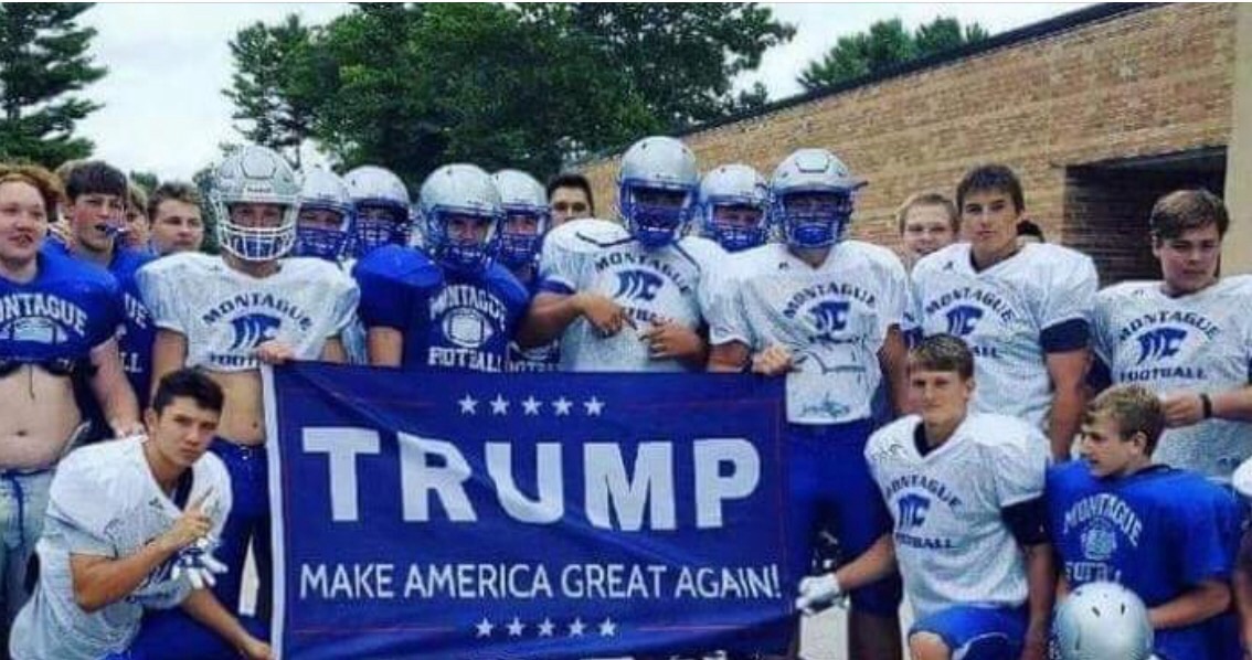 Football team’s political banner photo ‘discouraged’ by school.